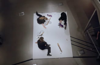 people on white canvas creating artwork