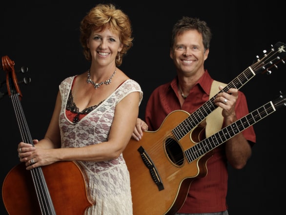 man and woman holding instruments