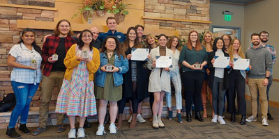 A group of students accepting a scholarship award