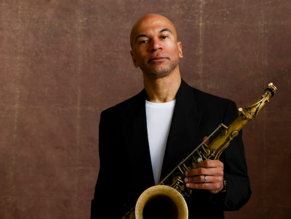 walter smith III holding saxophone