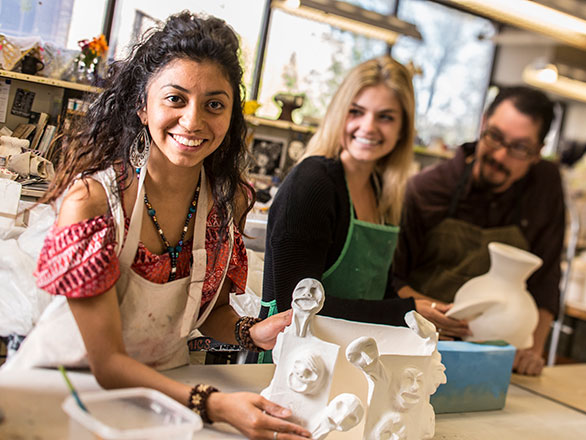 people working on sculptures