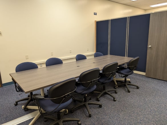 meeting room with large table and chairs
