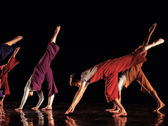 multiple people dancing with hands on floor