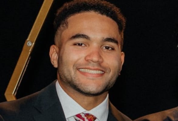 close up of man smiling in suit