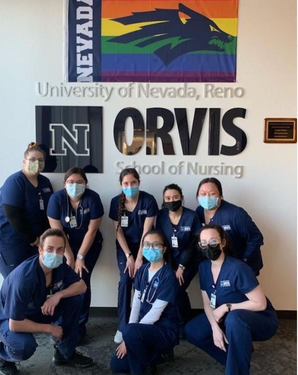 A group of students in the entry way to the Orvis School of Nursing