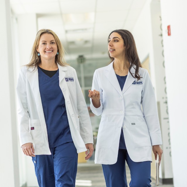 Two nursing students walking.