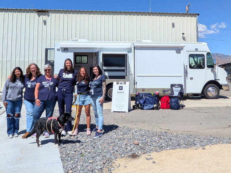 StreetReach team outside next to mobile health unit