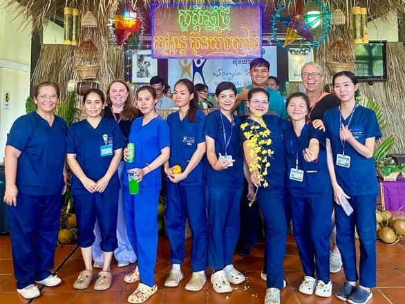 A group of Orvis nurses and partners from Sonja Kill Memorial Hospital pose for a group photo.