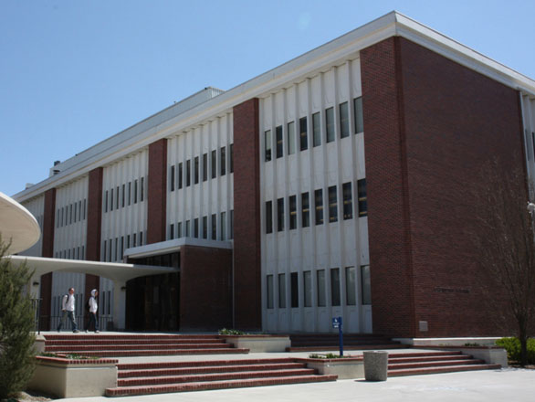 Two students walking out front of the Chemistry Building.