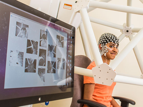 Student demonstrating how to use neuroscience equipment