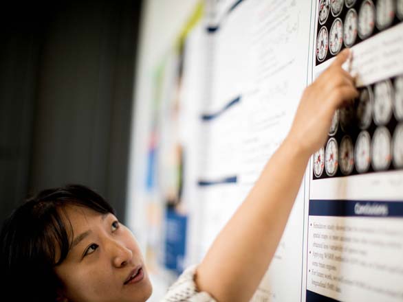 Professor Mihye Ahn discussing her research poster.