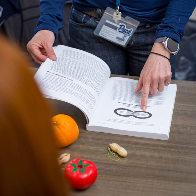 Doctor holding a bowl of fruit