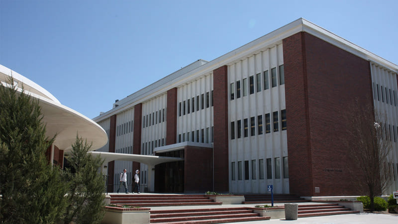 Exterior of the brick-covered Leifson Physics building attached to the Schulich lecture hall