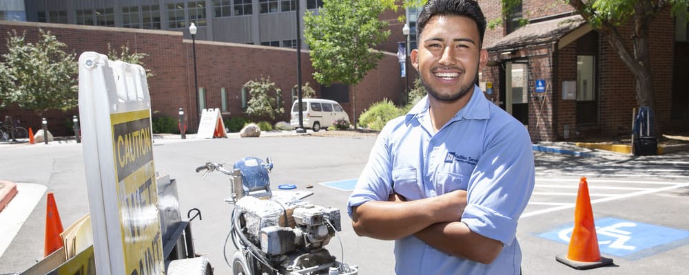 Jesus Murillo-Juarez, classified employee, smiles on the job