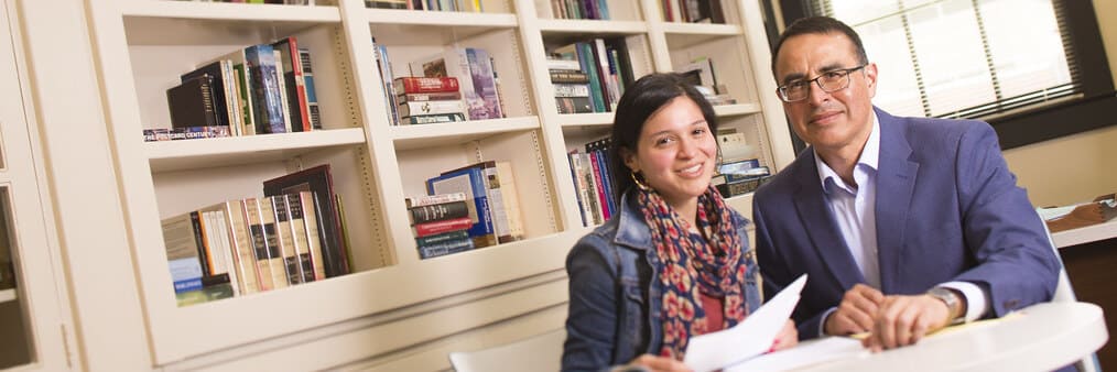 Professor meeting with graduate student