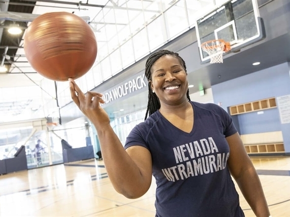 Sheena Harvey effortlessly spinning a basketball on her fingers