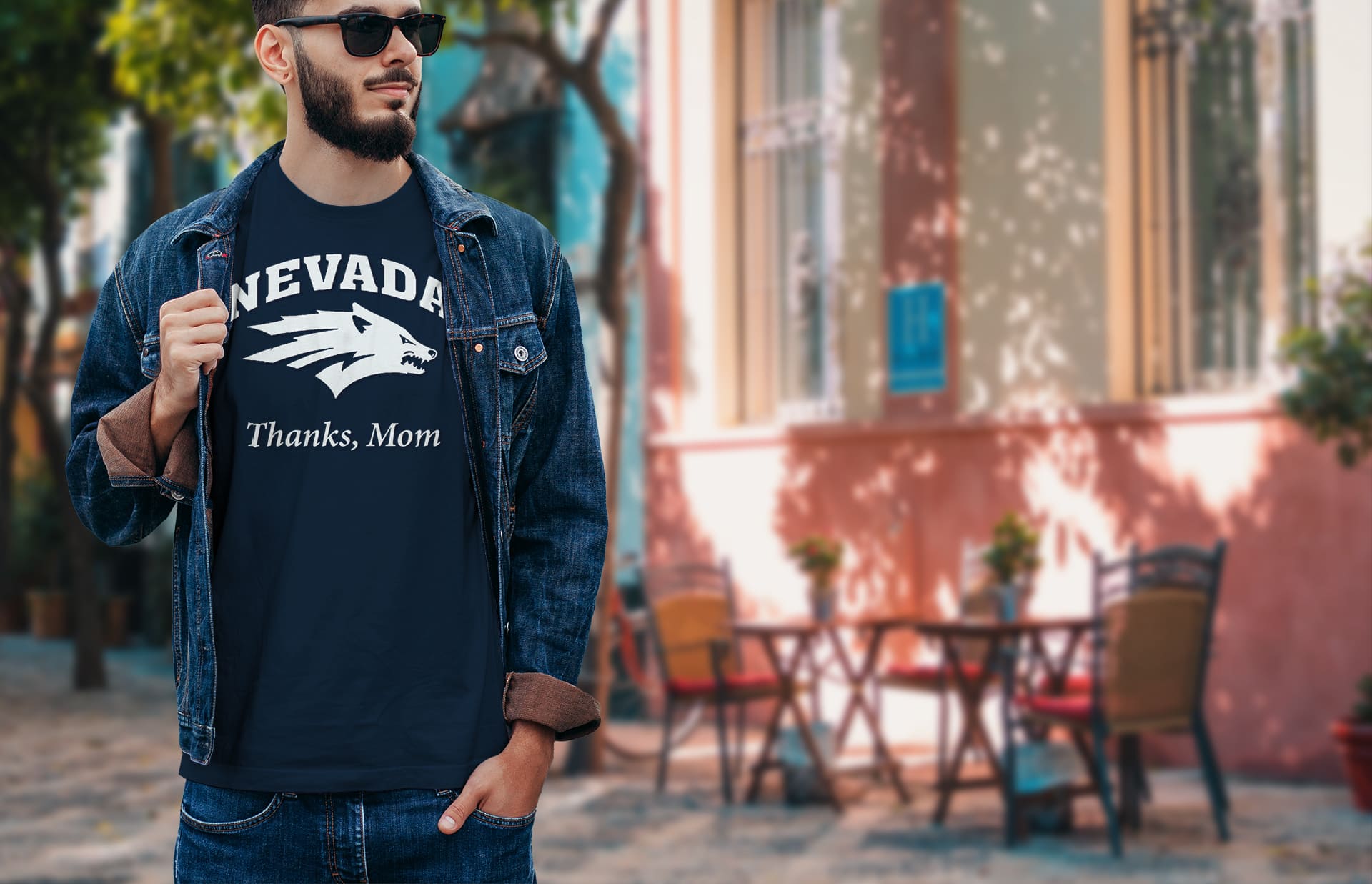 Student wearing a "thanks mom" teeshirt with the Nevada sports logo