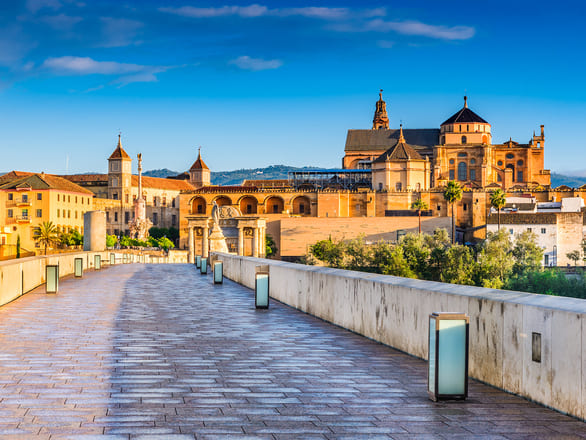 A walkway leading to a city in Spain