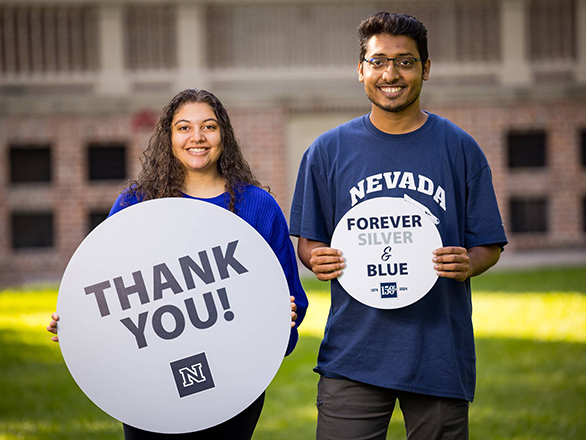 Student-athletes holding up a Thank You sign