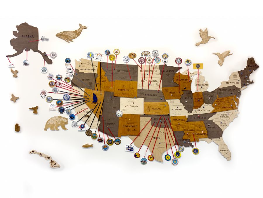 Wooden U.S. map with icons marking 53 tribes whose students are currently pursuing educational goals through the Native American Fee Waiver.