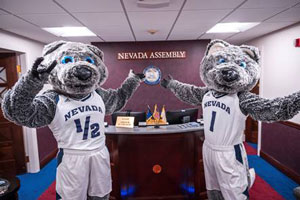 Mascots pose in front of the Nevada assembly