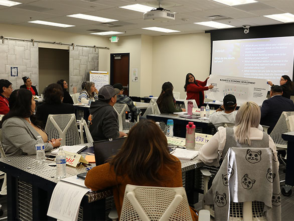 Group of future tribal leaders meet in a classroom with University of Nevada, Reno faculty to discuss Business and Economic Development.