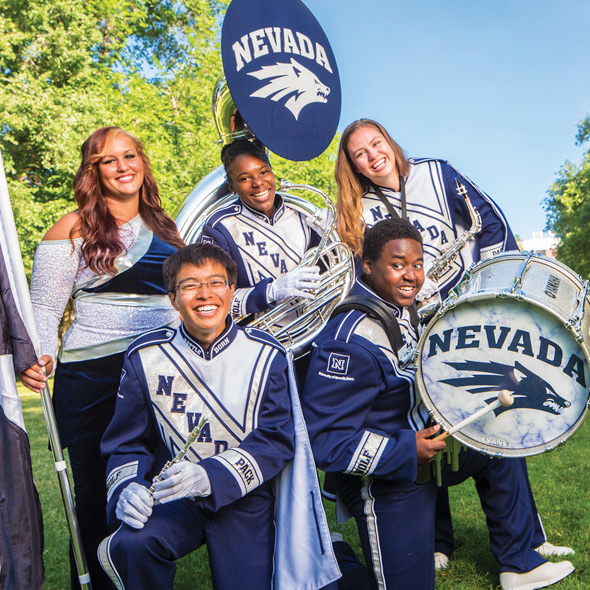 University band members playing outside in the quad