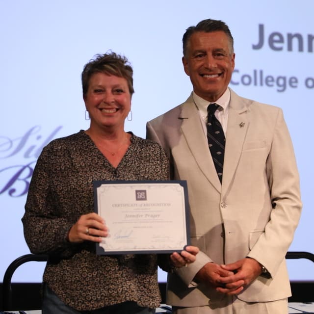 Jennifer Prager receiving her award from President Brian Sandoval
