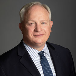 Headshot of Jeff Thompson wearing a suit and tie.