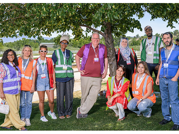Interpreters wearing colored vests to indicate language at World Refugee Day.