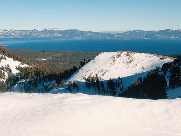 A snowy mountain overlooking Lake Tahoe.