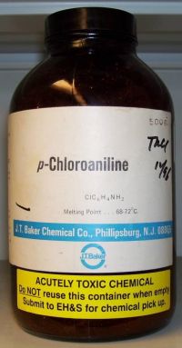 A bright yellow sticker on a chemical bottle stating “ACUTELY TOXIC CHEMICAL.  Do NOT reuse this container when empty.  Submit to EH&S for chemical pick up.”