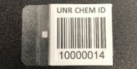 Barcode flag tag with "UNR CHEM ID" text above barcode and number below barcode