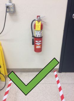 A fire extinguisher which is accessible and safe to approach