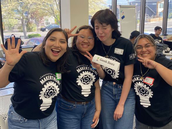 A team of four students posing for a group photo at the Makerthon in the Innevation Center