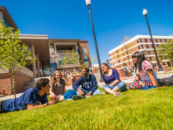 Students sitting on grass outside the pennington student center