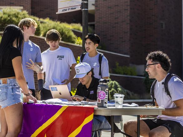 Students at a greek table event