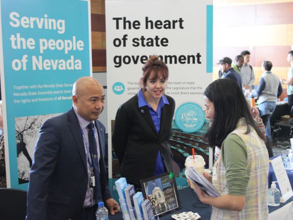 A student speaking with an employer at a Career & Internship Fair.