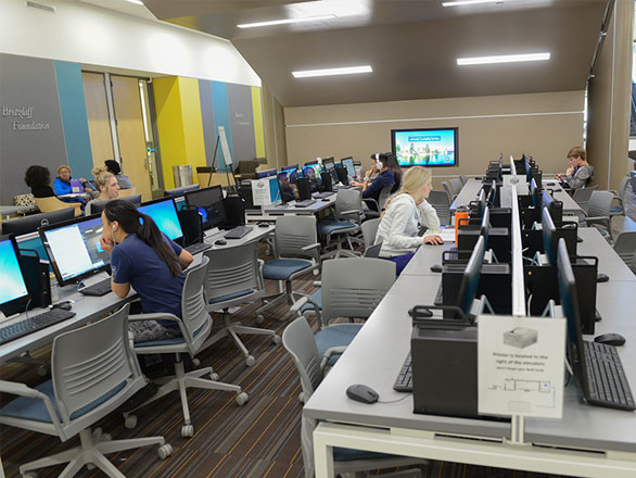 Students work at a computer lab 