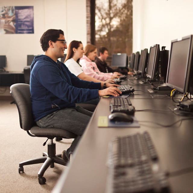 Students at computers learning
