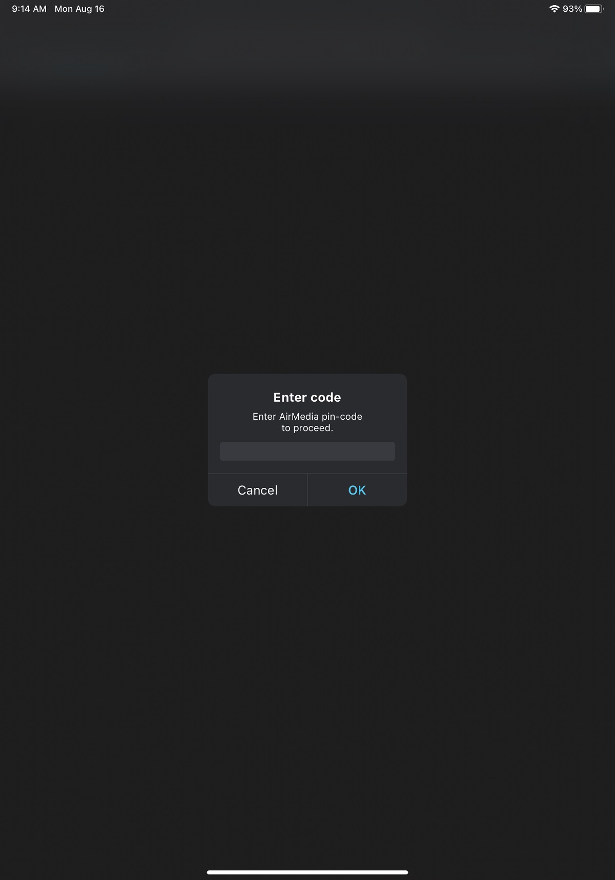 Screenshot of the Enter Code interface in the AirMedia app. The interface states: 'Enter AirMedia pin-code to proceed' and has an entry field and an 'OK' button to confirm.