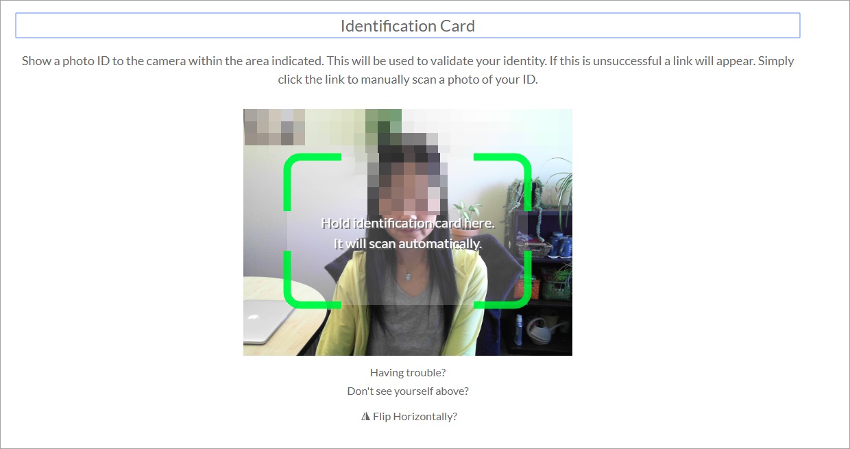 [Figure 7] Screenshot of the photo ID verificationtest. A greenbounding boxhighlights the area in the center of the screen where the ID is to be held.