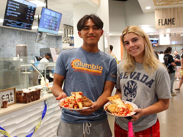 Three employees standing behind a counter