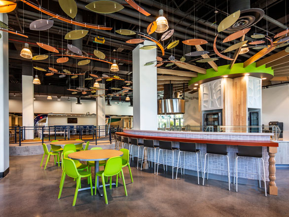 The inside of the Downunder Cafe, inclouding bar seating and an array of tables and chairs