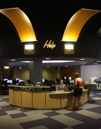 The @One help desk is an ideal place for students to seek assistance with their projects. Photo by Jean Dixon.