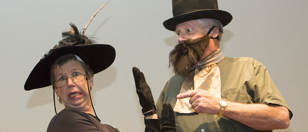 Jacquelyn Sundstrand, left, from University Libraries and Phil Boardman from the University's Department of English performing in a melodrama with silly costumes