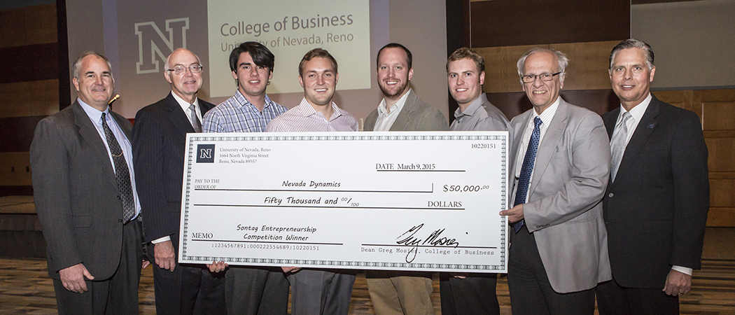 From left to right: Dave Croasdell, Charles and Ruth Hopping professor of entrepreneurship and Sontag Entrepreneurship competition director; University President Marc Johnson; Nevada Dynamics team members Zachary Carlson, Erik Edgington, MacCallister Higgins and Nolan Young; College of Engineering Dean Manos Maragakis; College of Business Dean Greg Mosier. 