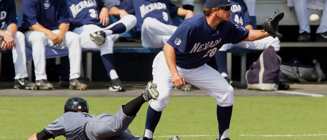 UNR baseball player catching ball.