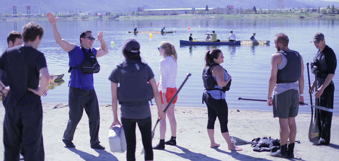 Students hang out at lake during practice for canoe event