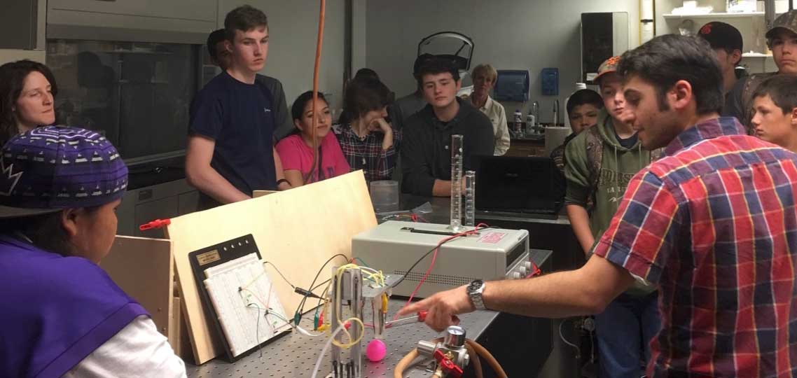 Area middle and high school students view a demonstration of the soft gripper during Engineer's Day. 